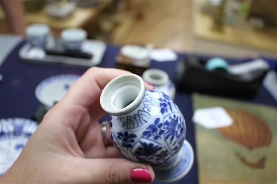 A Chinese blue and white tea bowl and saucer and two jars, Kangxi, some damage largest diameter 11cm